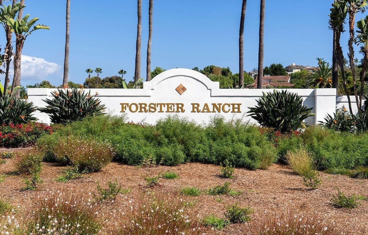 Forster Ranch entrance monument sign surrounded by landscaping and palm trees in San Clemente