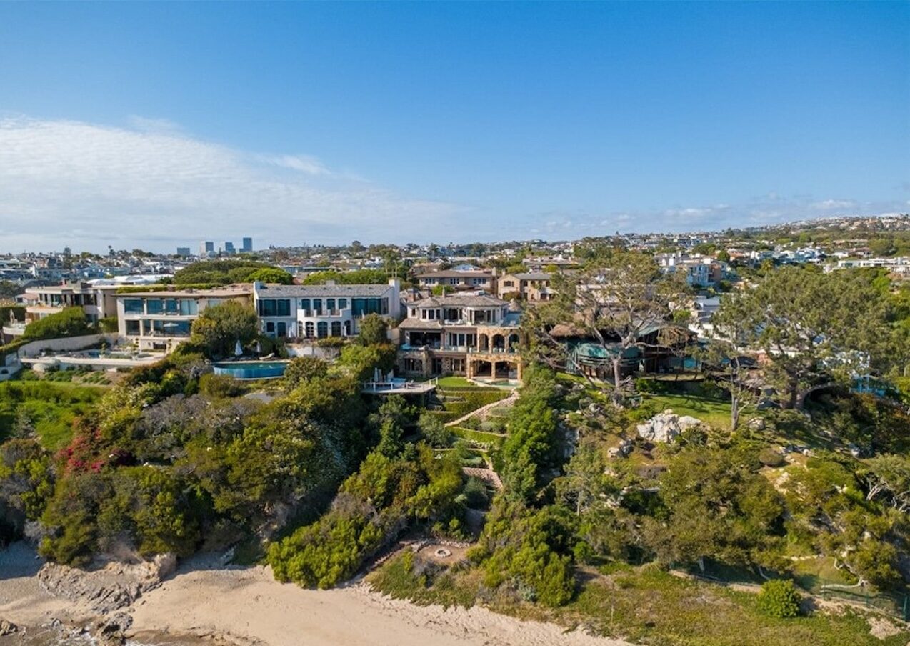 Aerial view of coastal homes above the shoreline and beach in Shorecliffs, San Clemente